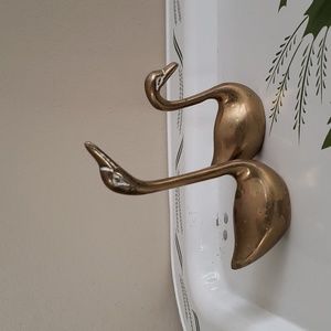 Two mini brass swans